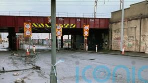 Man, 60, remains in critical condition after bus hits rail bridge