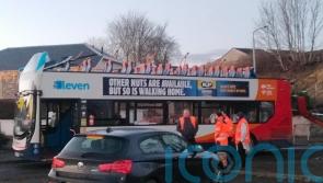 Four in hospital after roof of double-decker bus ripped off in bridge collision