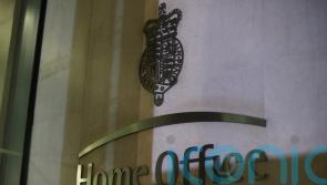 Man in custody after Albanian nationals found hidden in livestock wagon