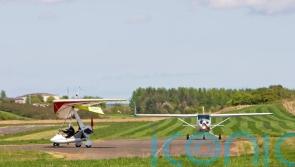 Emergency services at scene after light aircraft crashes near airport