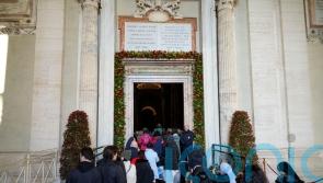 Pilgrims pass through Vatican Holy Door as the 2025 Holy Year begins
