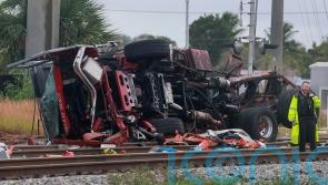 Firefighters and passengers hurt after train hits fire truck on crossing