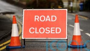 Properties evacuated and road closed after lorry hit gas main