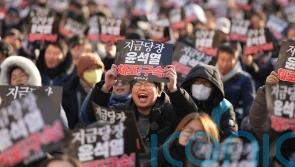 South Korean agency asks police to take over efforts to detain president