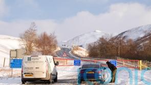 Flights disrupted and schools closed for second day as wintry weather continues