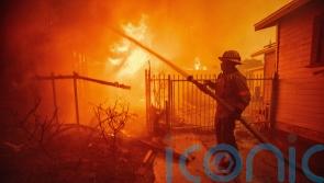 Five dead as wildfires burn out of control across Los Angeles area