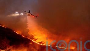 Firefighters hoping for break from fierce winds that have fuelled LA wildfires