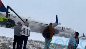 Four hurt as Delta plane aborts take-off from snowy Atlanta airport