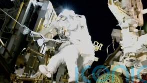 Nasa’s stuck astronaut steps out on spacewalk after seven months in orbit