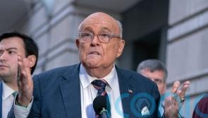 Giuliani reaches settlement over home and baseball rings in defamation case
