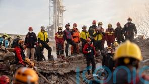 Two people trapped after apartment building collapses in central Turkey