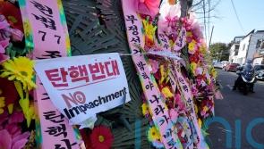 South Koreans turn to flower wreaths and K-pop light sticks as political symbols