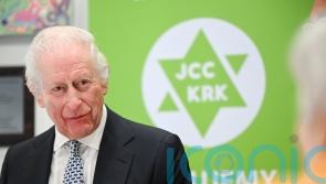 King pays tribute to Holocaust survivors amid Auschwitz commemorations