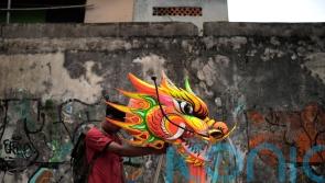 In Pictures: Indonesia welcomes the Year of the Snake with dragons and drums