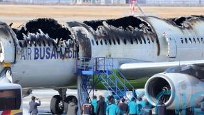 Passengers evacuated after plane catches fire at South Korean airport