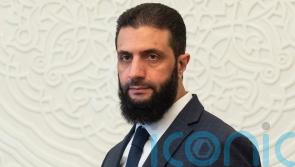 Leader of rebels who toppled Syrian president Assad named interim president