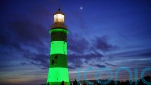 Plymouth lighthouse lit up green in memory of university lecturer