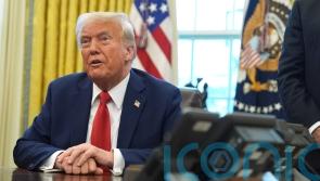 Wall Street falls as Trump imposes tariffs, but not as badly as feared