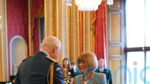 Anna Wintour says she will not stop working as she is honoured at palace