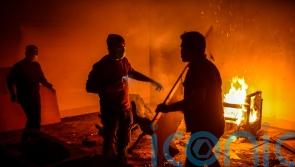 Bangladeshi protesters storm and destroy house linked to exiled former PM Hasina