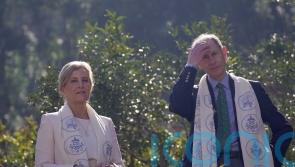 Edward and Sophie joke together and hold hands on tour of Nepali botanic garden