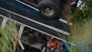 Dozens die in Guatemala after bus plunges off bridge