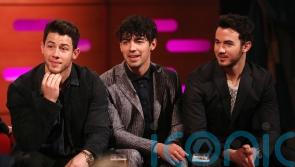 Jonas Brothers thank fans for 20 years’ support and tease new music and movie