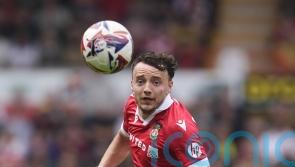 Wrexham win at Northampton to maintain promotion hopes