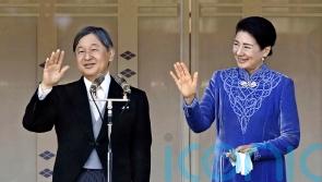 Japan’s emperor marks 65th birthday saying tragedy of war must be remembered