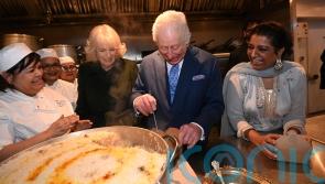 King and Queen help pack food donation boxes at restaurant ahead of Ramadan