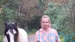 Two men arrested after woman found dead in her home