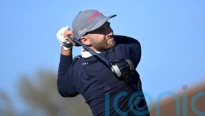 Wyndham Clark grabs two-stroke lead as wind hits first round