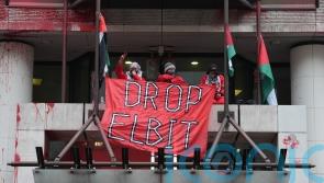 Pro-Palestine protesters spray red paint on insurance giant’s offices