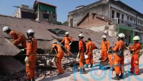 Woman pulled alive from collapsed building 91 hours after earthquake