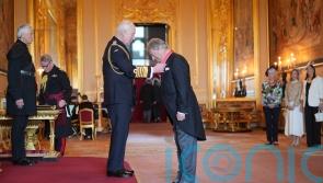 King returns to public duties with investiture ceremony at Windsor Castle