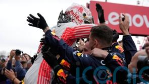 Max Verstappen wins Japanese Grand Prix after pit-lane tussle with Lando Norris