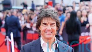 Tom Cruise hangs off moving planes in new Mission: Impossible trailer