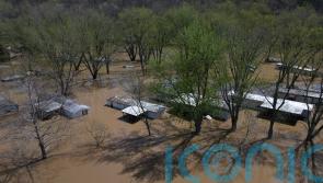 Swollen rivers flood towns in southern US after prolonged deluge