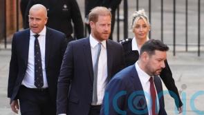 Harry and Meghan ‘felt forced to step back’ from royal family, court told