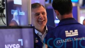 S&P 500 jumps 1.8% as Wall Street closes a chaotic and historic week