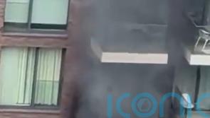 Fire at block of flats tackled by 100 firefighters