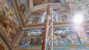 Vatican workers install Sistine Chapel stove ahead of conclave