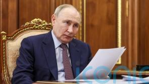Russia says Putin will travel to China in August