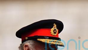 King speaks of ‘global uncertainty’ as he presents new standards to regiments