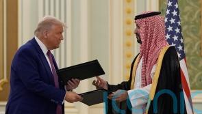 Trump and Saudi prince sign agreements as US leader begins Middle East tour