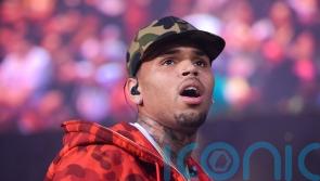 Singer Chris Brown to appear in court charged with grievous bodily harm