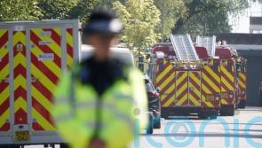 Man and two firefighters killed in fire at former RAF base named