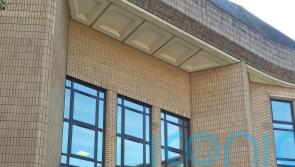 Former MP appears in court charged with harassing ex-wife