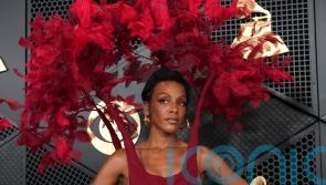 Singer tells court Combs threatened to kill her after she saw him hit girlfriend