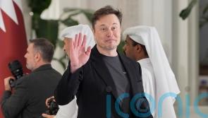 Elon Musk says he is committed to still being Tesla chief in five years’ time